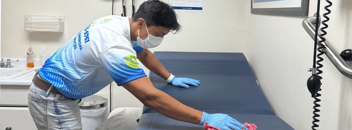person cleaning beds
