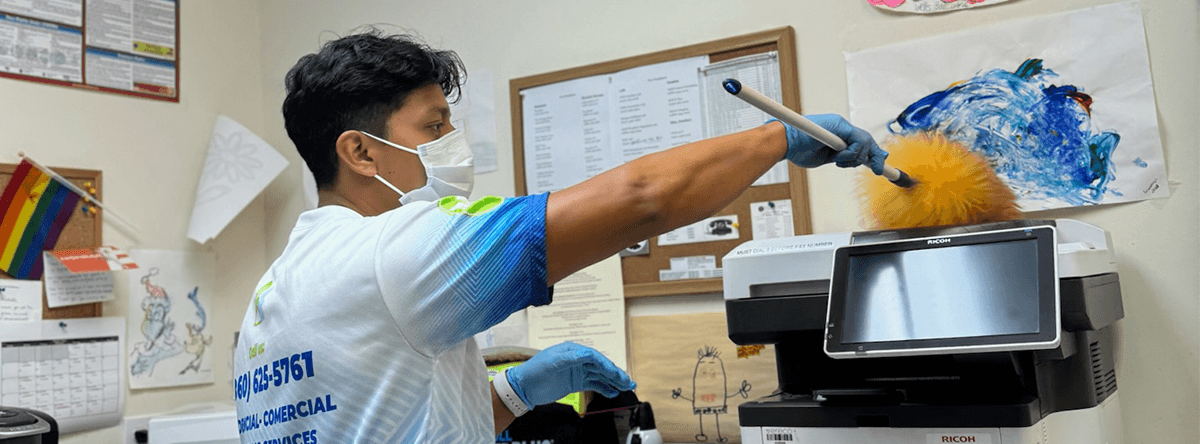person cleaning equipment
