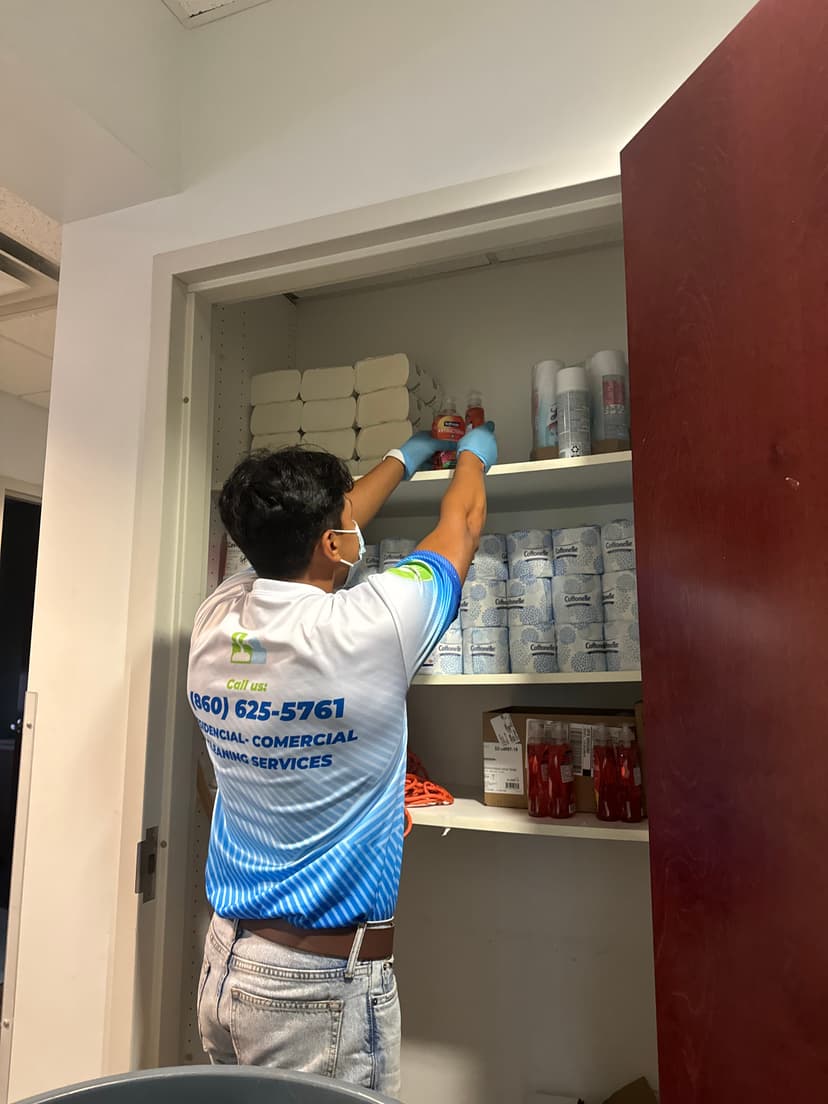person cleaning household items